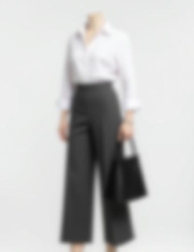 Clean minimalist work outfit: wide-leg trousers, crisp white shirt, and structured tote bag.