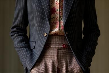 Close-up of a person confidently wearing mixed patterns.